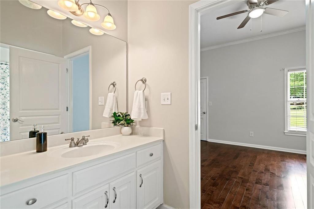 106 Shalea Lane Ball Ground, GA 30107 - Photo 31 of 52 a bathroom with a double vanity sink mirror and vanity
