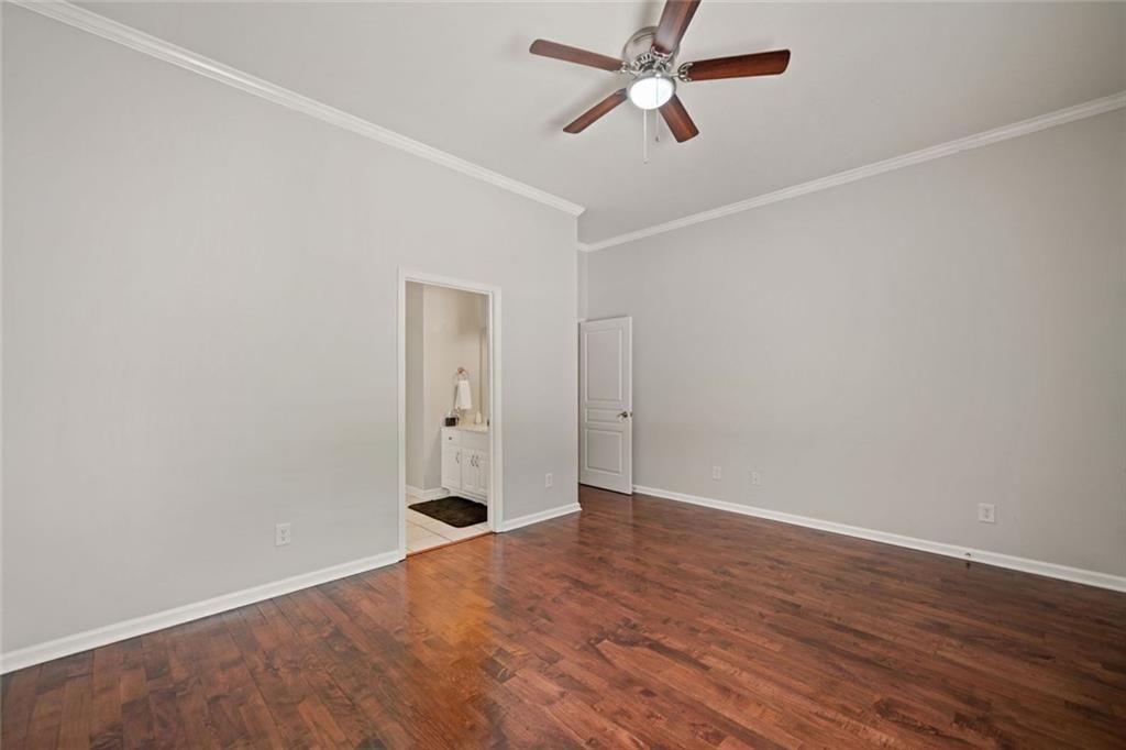 106 Shalea Lane Ball Ground, GA 30107 - Photo 34 of 52 an empty room with wooden floor and windows