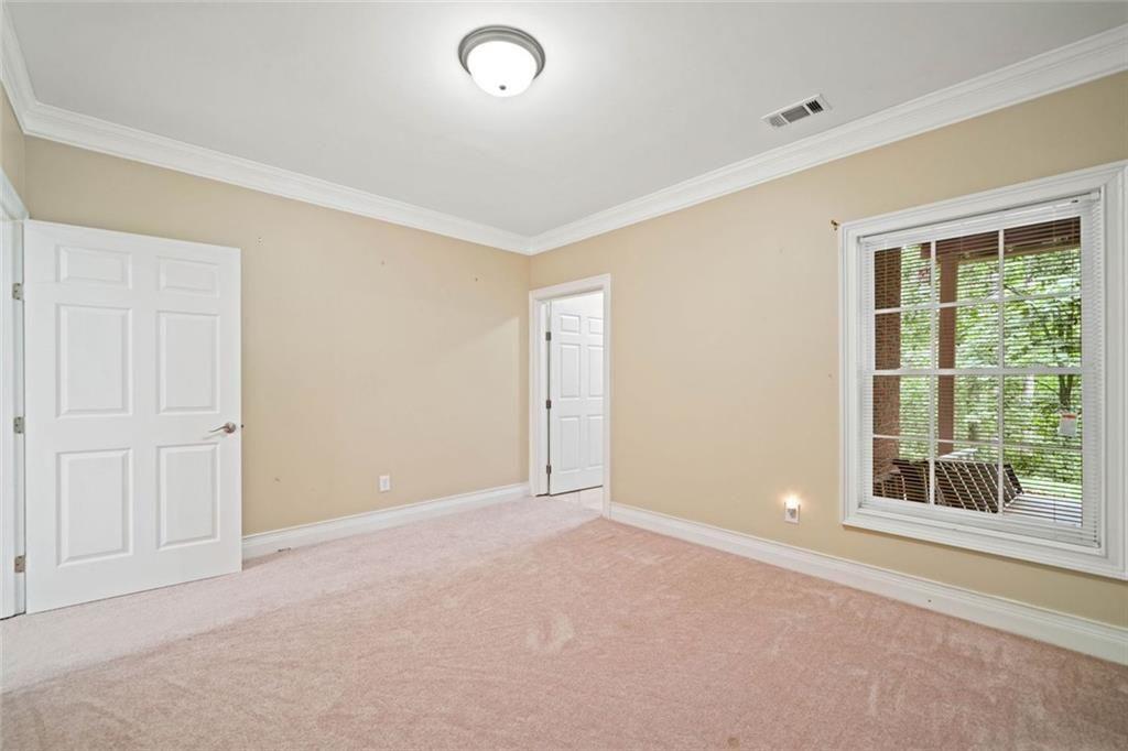 106 Shalea Lane Ball Ground, GA 30107 - Photo 41 of 52 a view of an empty room with a window