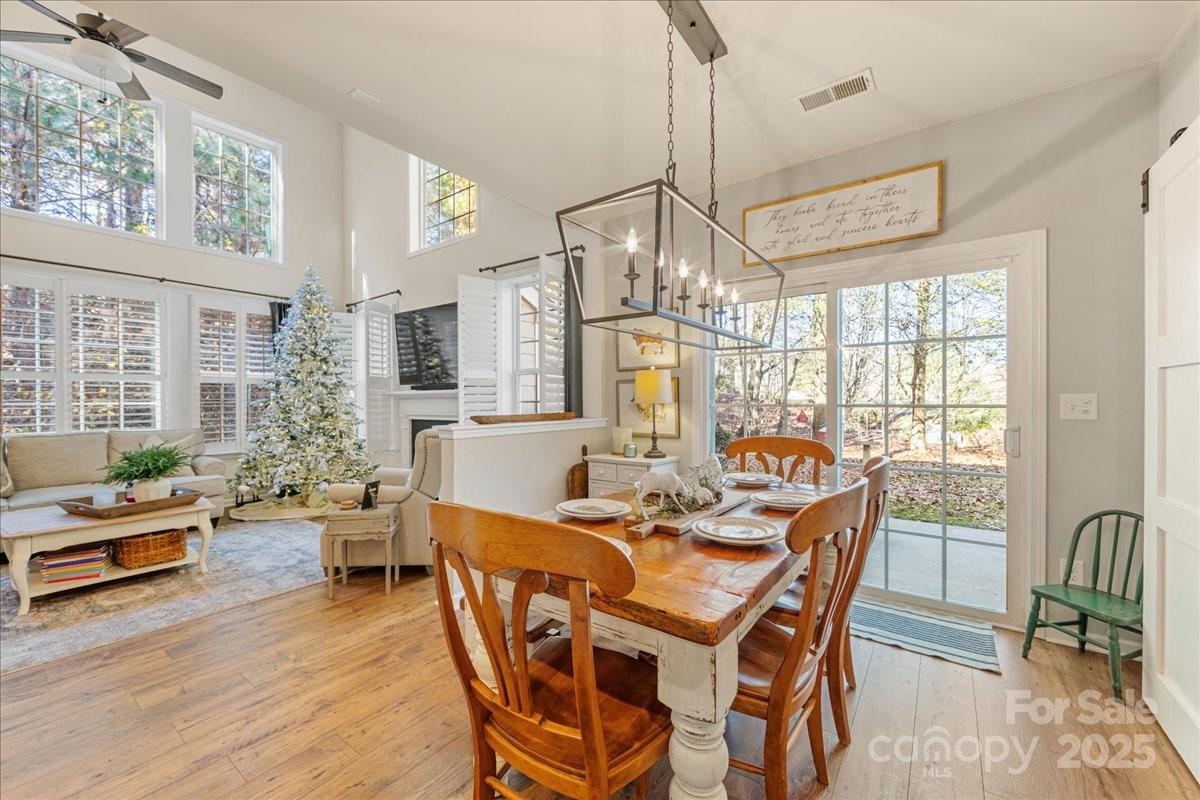 718 Deerbrook Lane Tega Cay, SC 29708 - Photo 25 of 45 a view of a dining room with furniture window and wooden floor