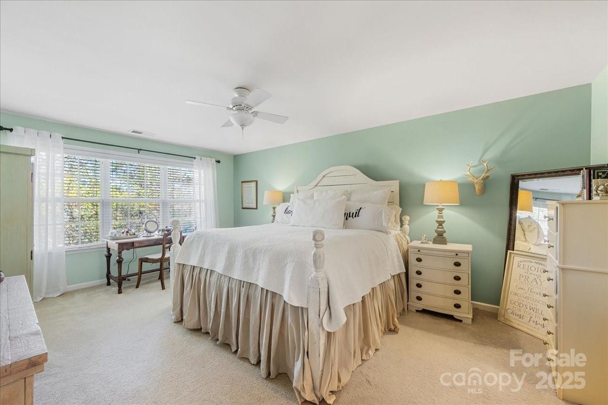 718 Deerbrook Lane Tega Cay, SC 29708 - Photo 31 of 45 a bedroom with a bed and a large window