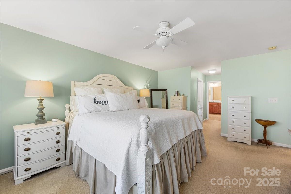 718 Deerbrook Lane Tega Cay, SC 29708 - Photo 32 of 45 a bedroom with a bed and a lamp