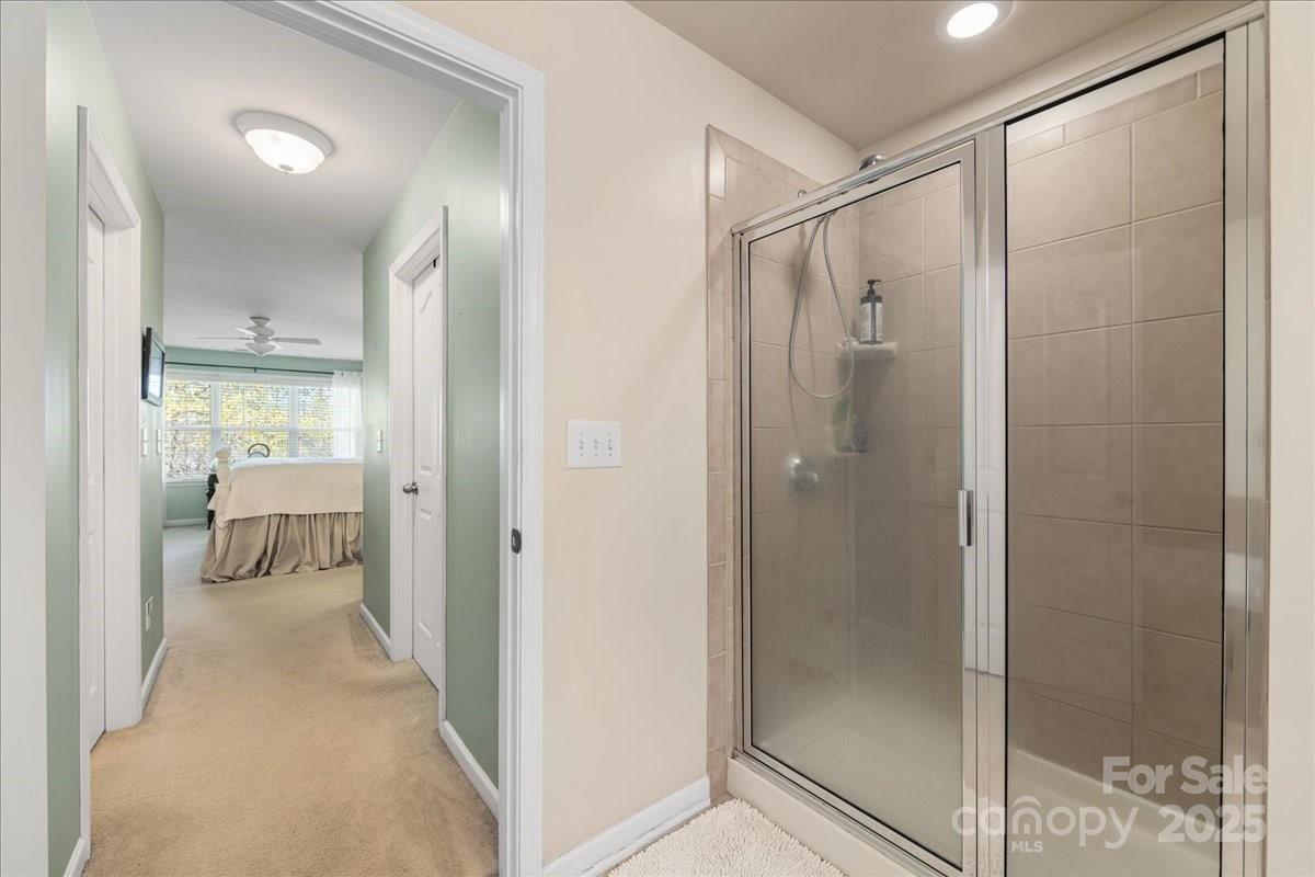718 Deerbrook Lane Tega Cay, SC 29708 - Photo 35 of 45 a bathroom with a glass shower door and a sink