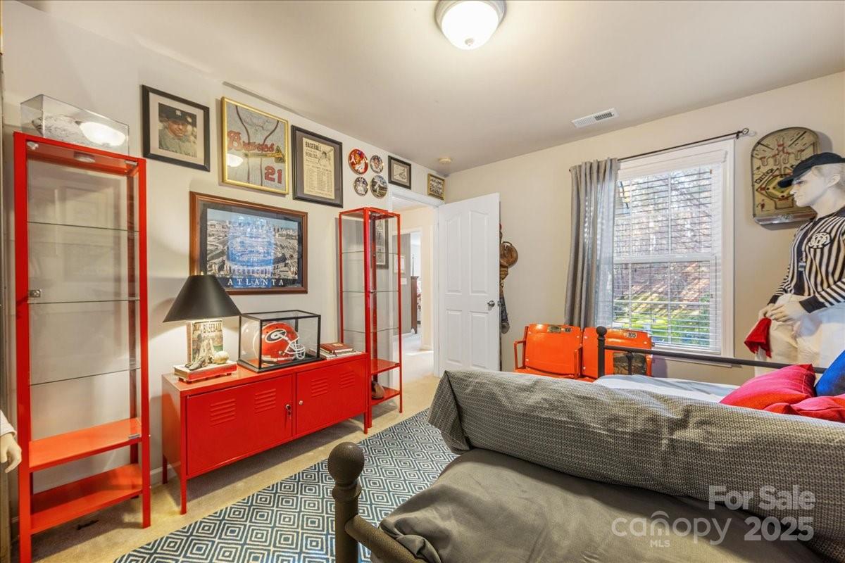 718 Deerbrook Lane Tega Cay, SC 29708 - Photo 36 of 45 a living room with furniture and a window