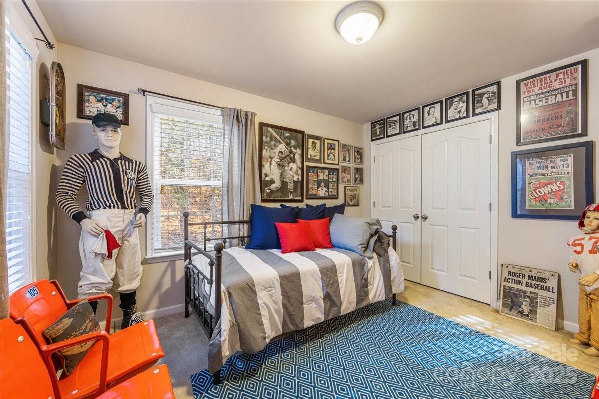 718 Deerbrook Lane Tega Cay, SC 29708 - Photo 37 of 45 a bedroom with a bed and wooden floor