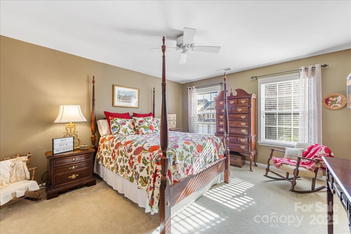 718 Deerbrook Lane Tega Cay, SC 29708 - Photo 39 of 45 a bed room with a bed and a chair