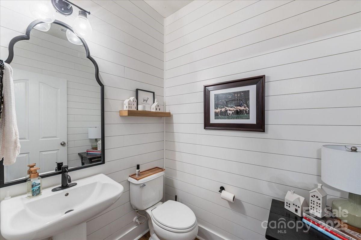 718 Deerbrook Lane Tega Cay, SC 29708 - Photo 5 of 45 a bathroom with a toilet sink and mirror