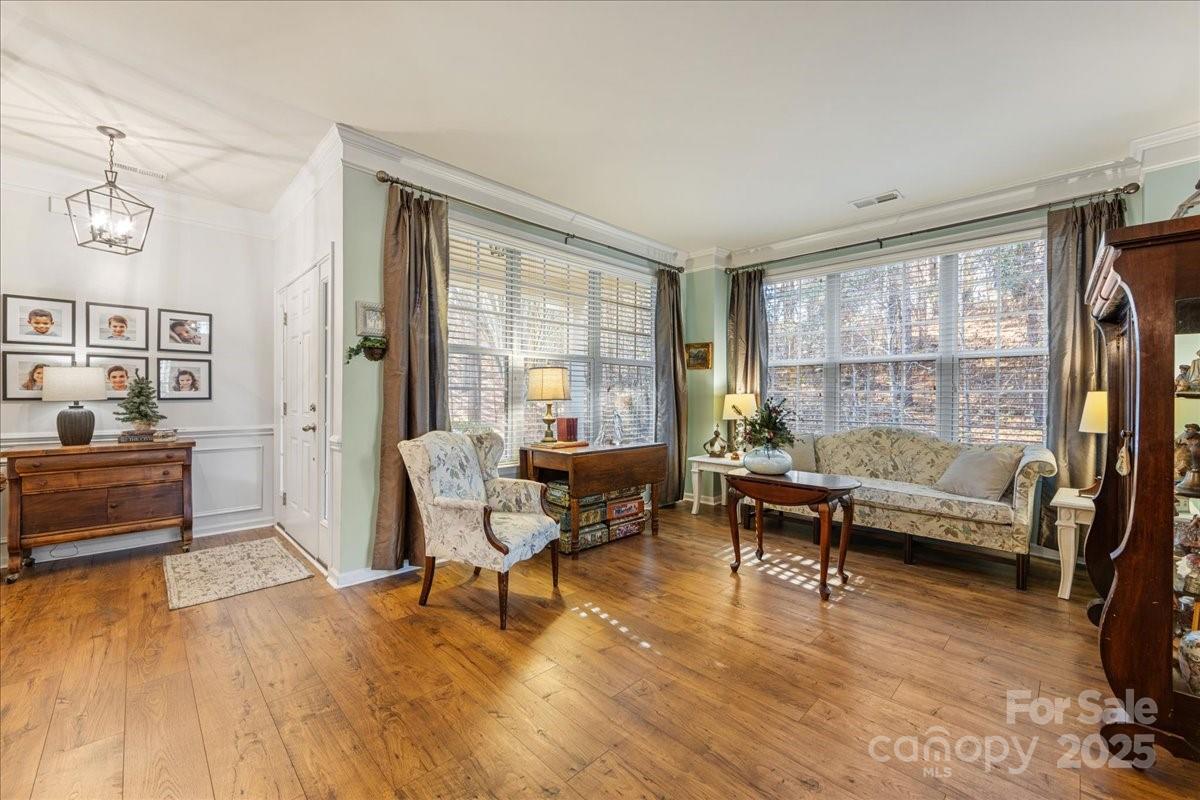 718 Deerbrook Lane Tega Cay, SC 29708 - Photo 7 of 45 a living room with furniture and a wooden floor
