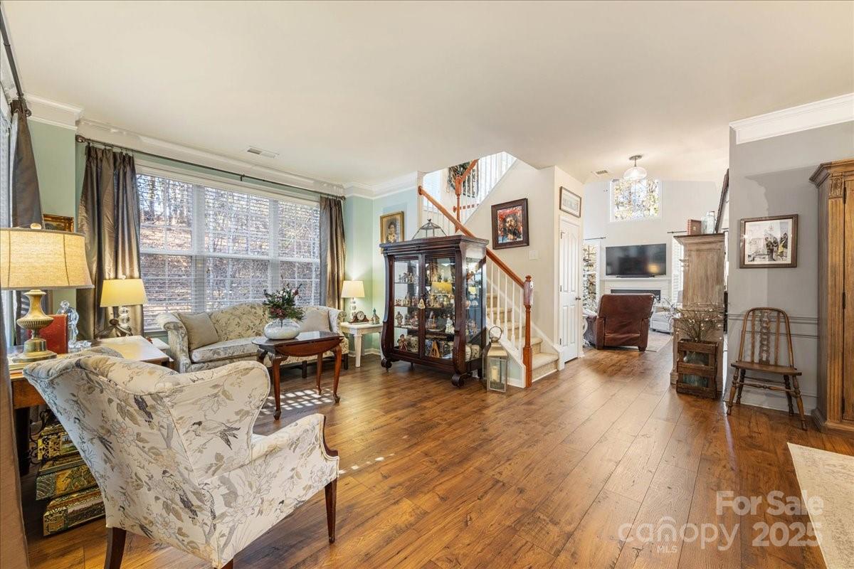 718 Deerbrook Lane Tega Cay, SC 29708 - Photo 8 of 45 a living room with fireplace furniture and a large window