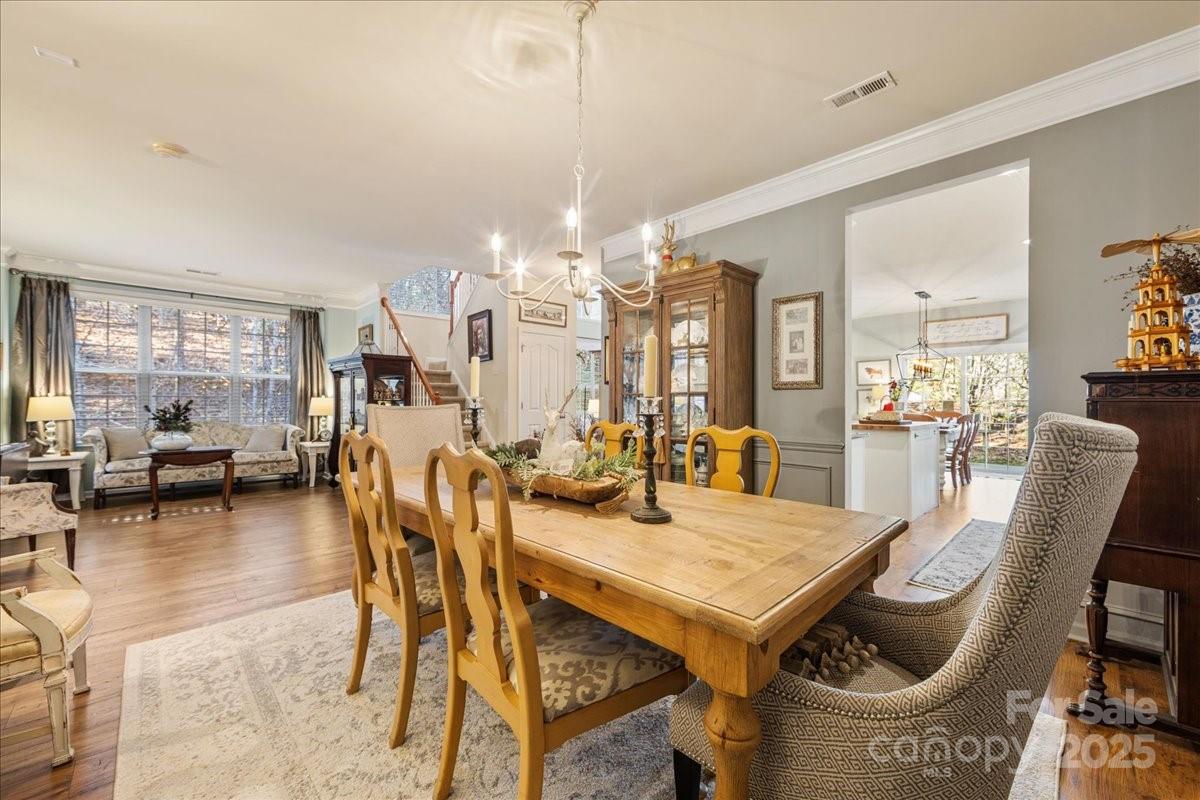 718 Deerbrook Lane Tega Cay, SC 29708 - Photo 10 of 45 a view of a dining room with furniture and chandelier