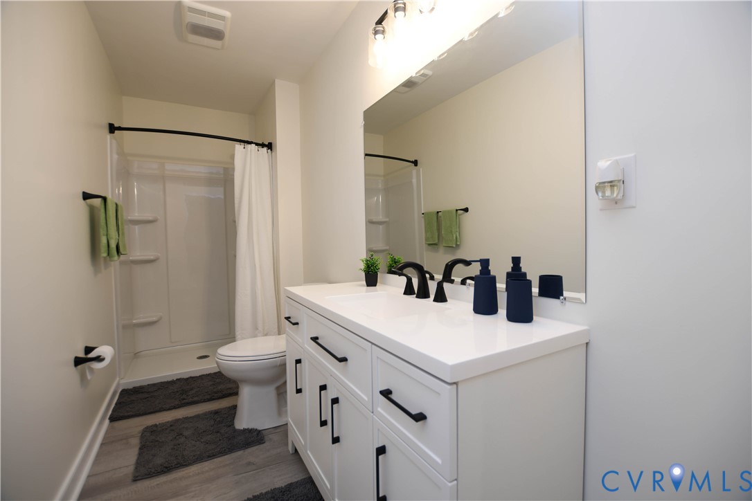 1448 Canterbury Road St. Stephens Church, VA 23148 - Photo 34 of 57 Downstairs Bathroom featuring a white vanity with