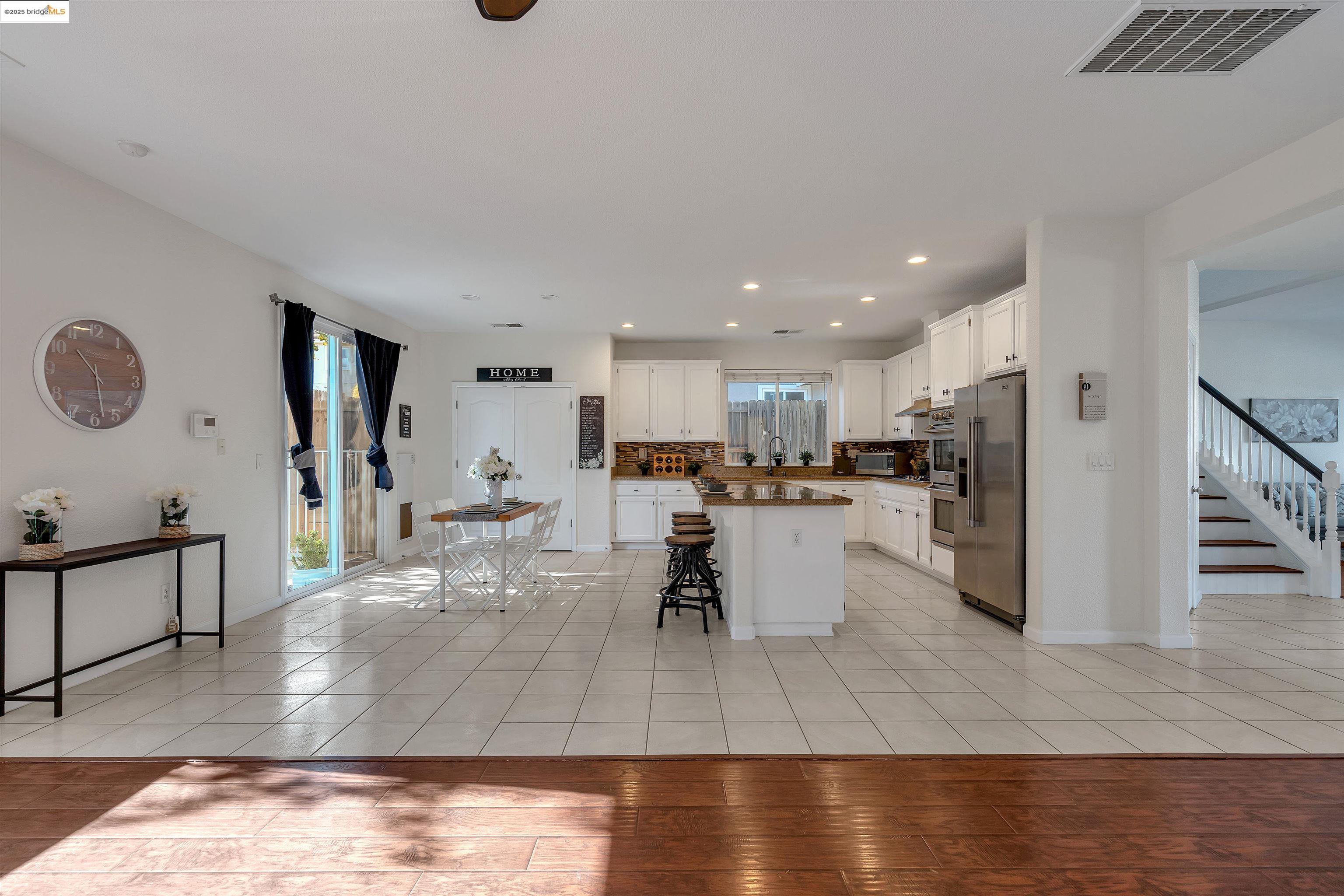166 Rangewood Drive Pittsburg, CA 94565 - Photo 13 of 42 a living room with dining room and wooden floor