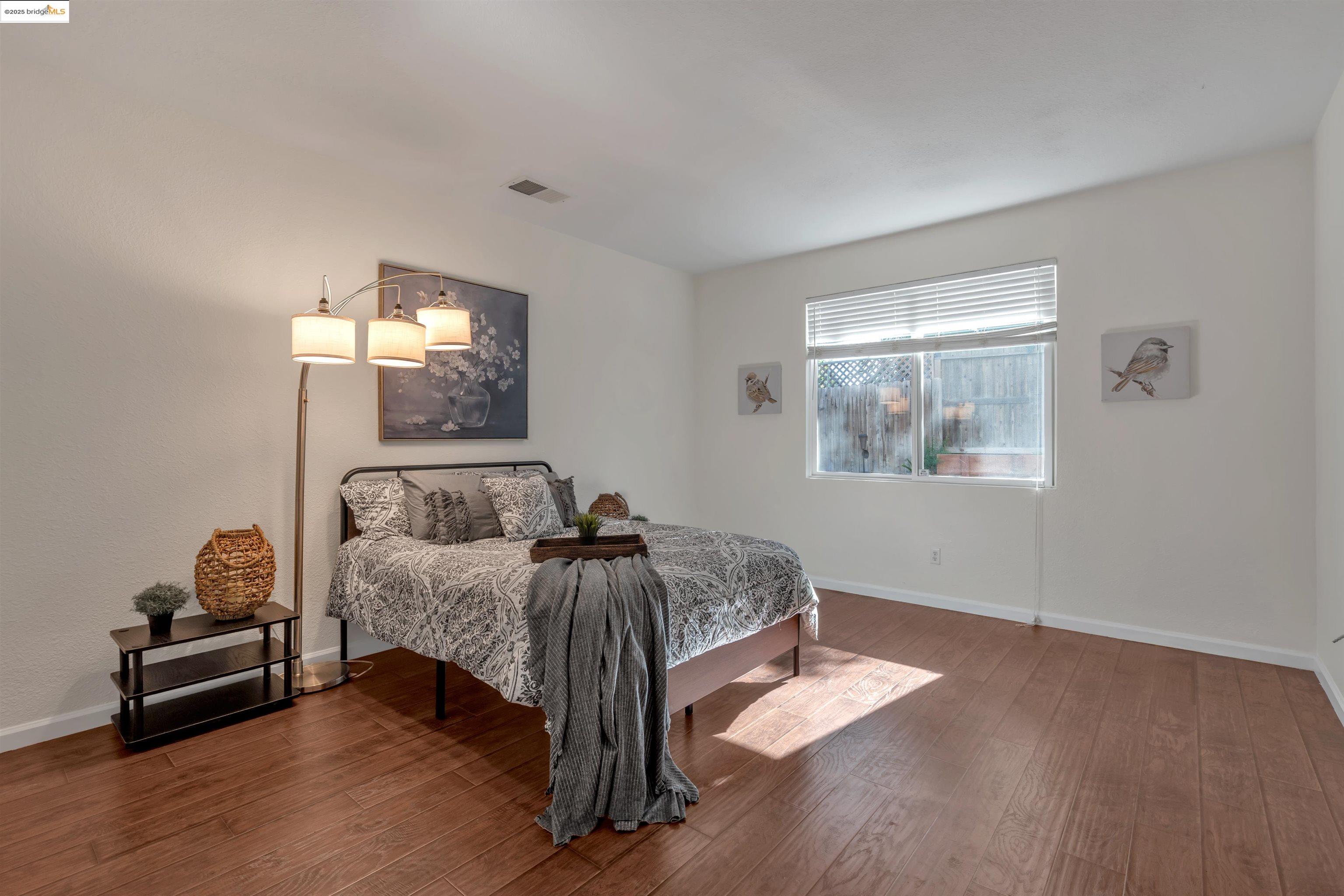 166 Rangewood Drive Pittsburg, CA 94565 - Photo 16 of 42 a bedroom with furniture and a window