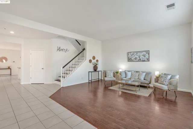 a view of entryway livingroom and hall with wooden floor