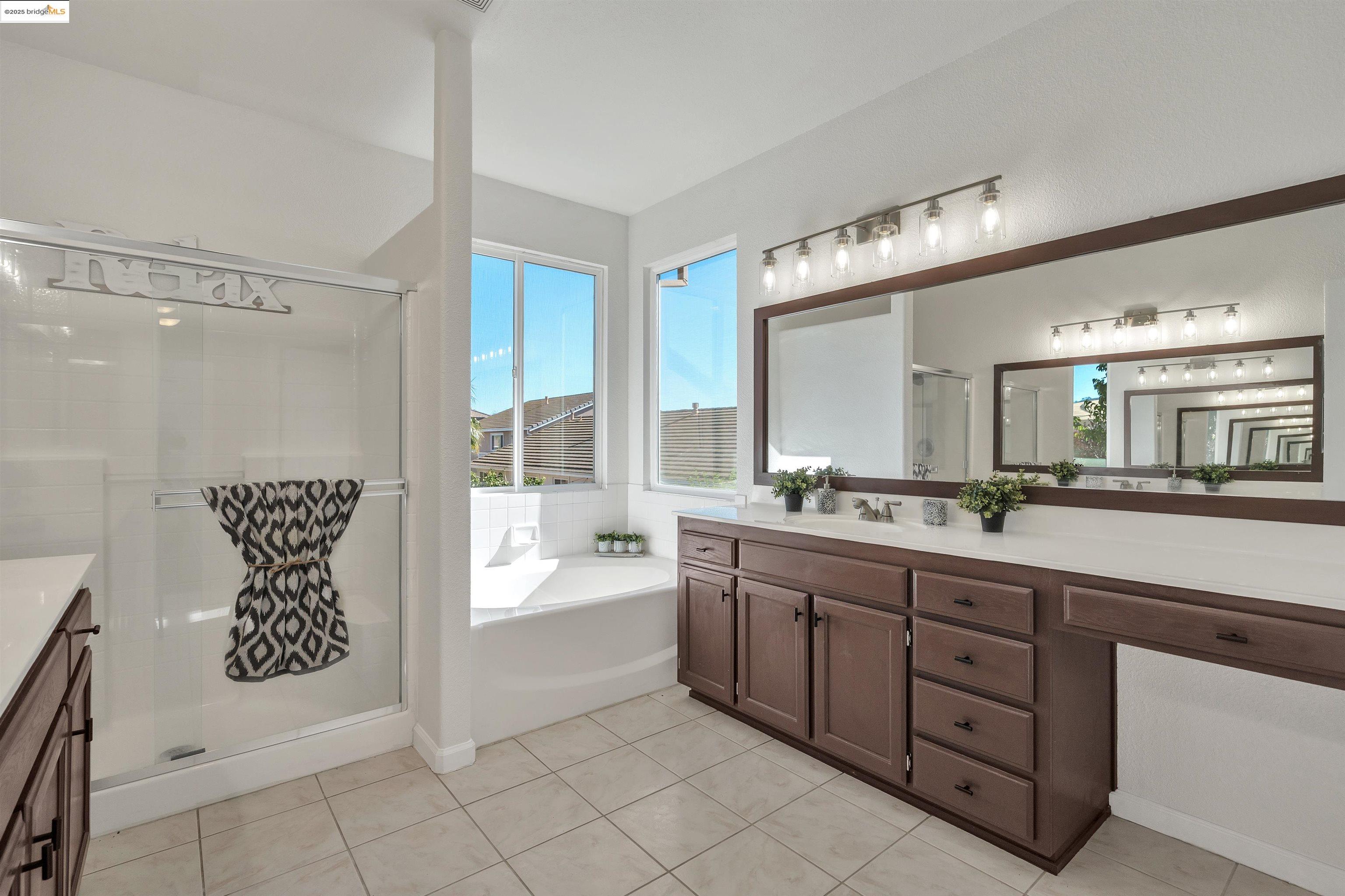 166 Rangewood Drive Pittsburg, CA 94565 - Photo 22 of 42 a spacious bathroom with a granite countertop sink mirror and bathtub