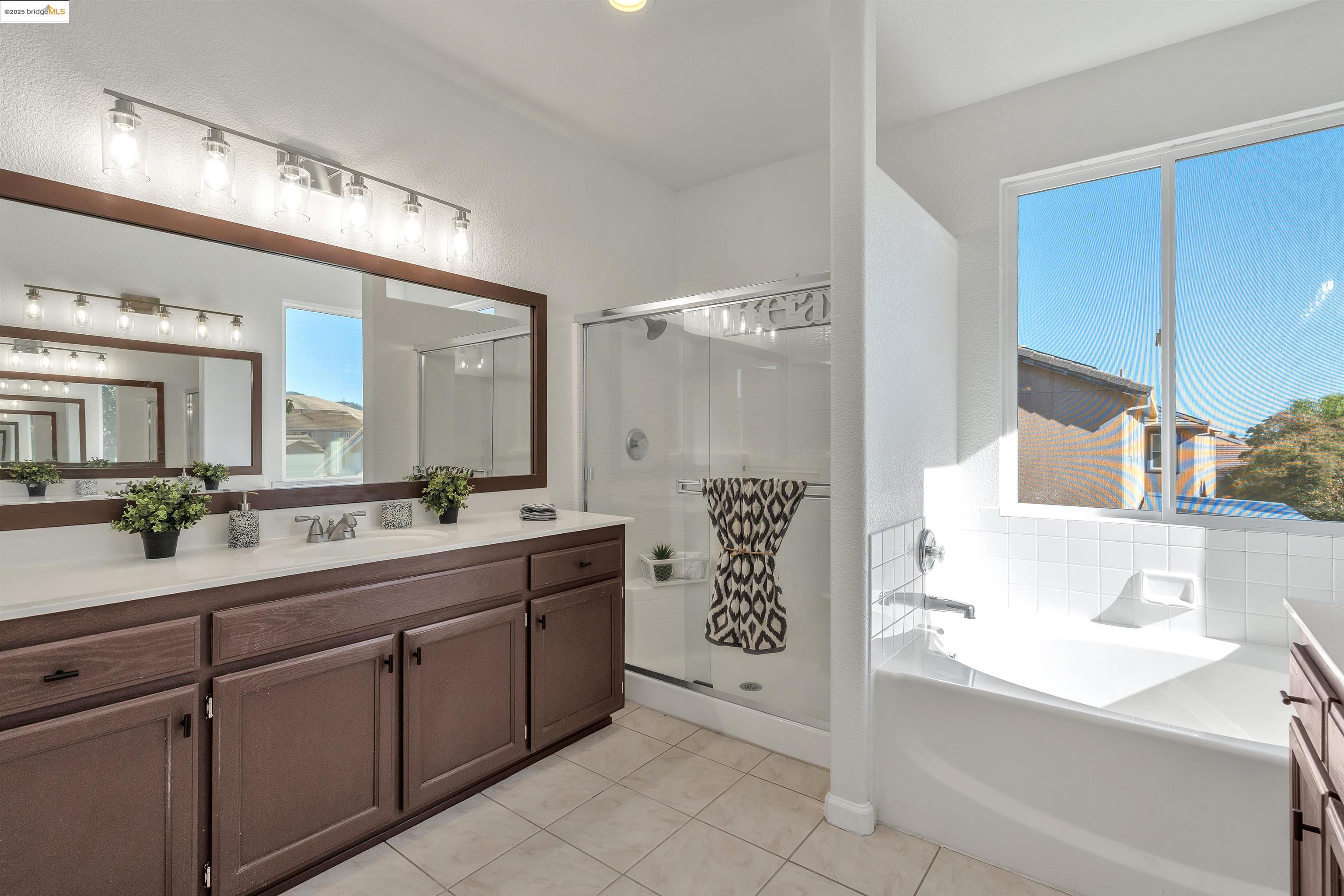 166 Rangewood Drive Pittsburg, CA 94565 - Photo 23 of 42 a spacious bathroom with a sink a mirror and a bathtub