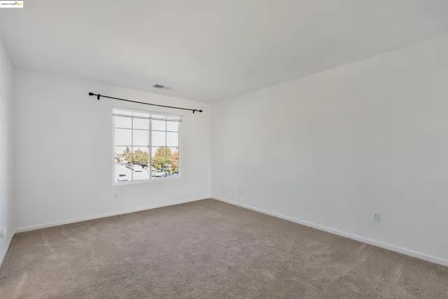 a view of a workspace with furniture and wooden floor