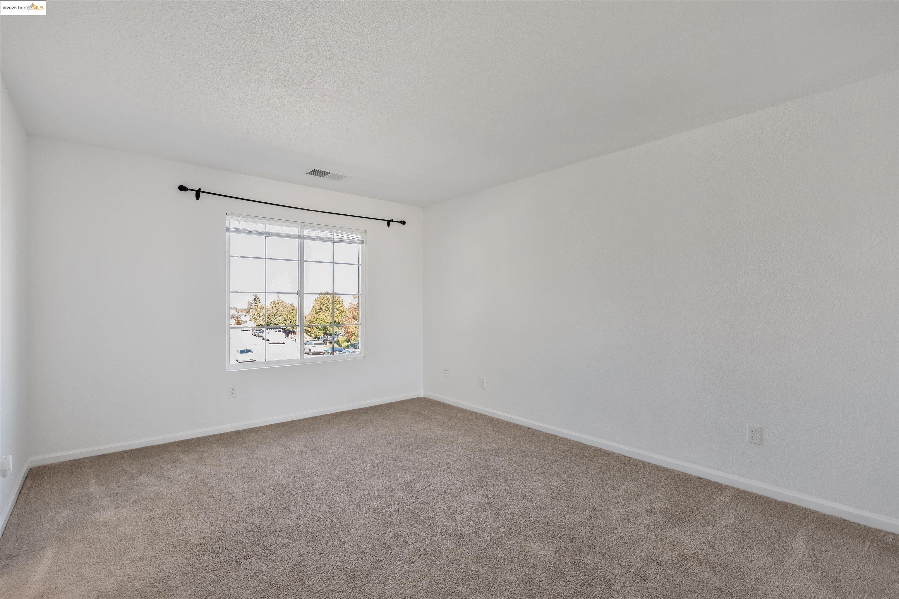 166 Rangewood Drive Pittsburg, CA 94565 - Photo 26 of 42 an empty room with windows