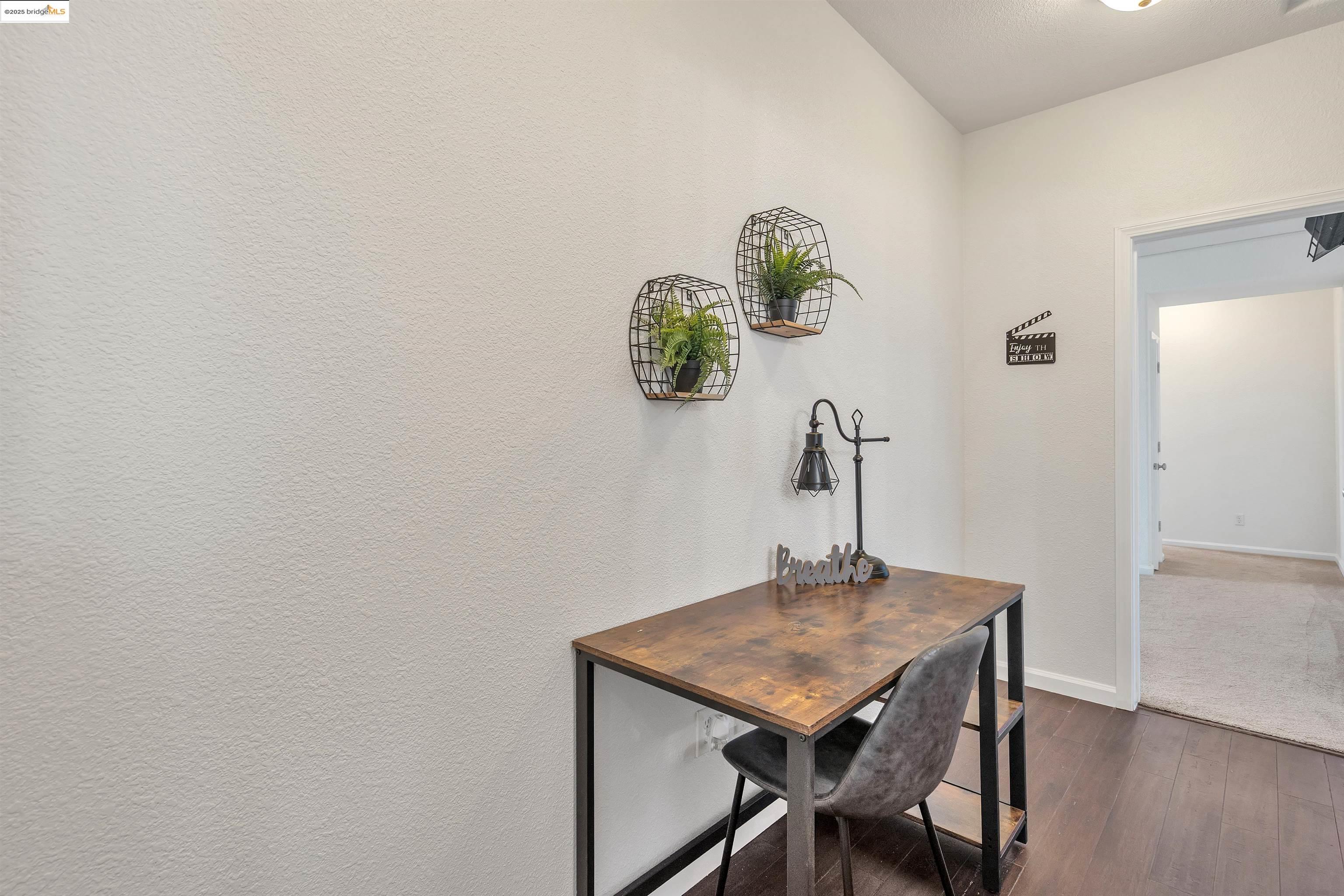 166 Rangewood Drive Pittsburg, CA 94565 - Photo 27 of 42 a view of a workspace with furniture and wooden floor