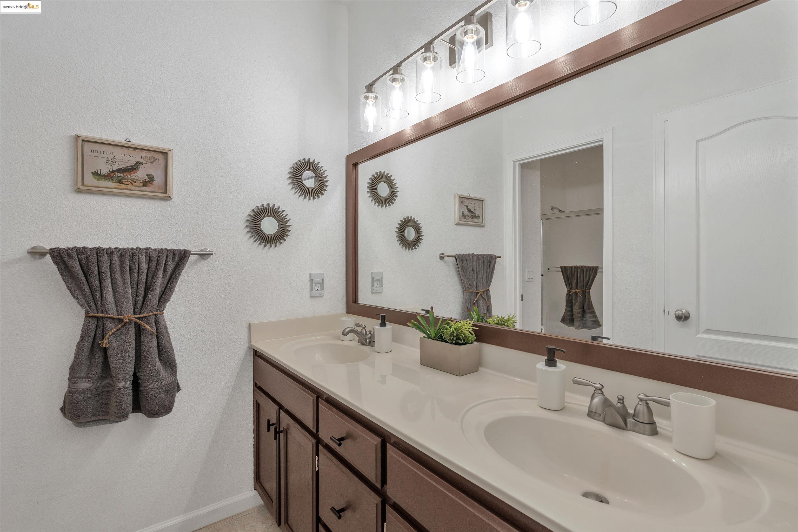 166 Rangewood Drive Pittsburg, CA 94565 - Photo 29 of 42 a bathroom with a sink and a mirror