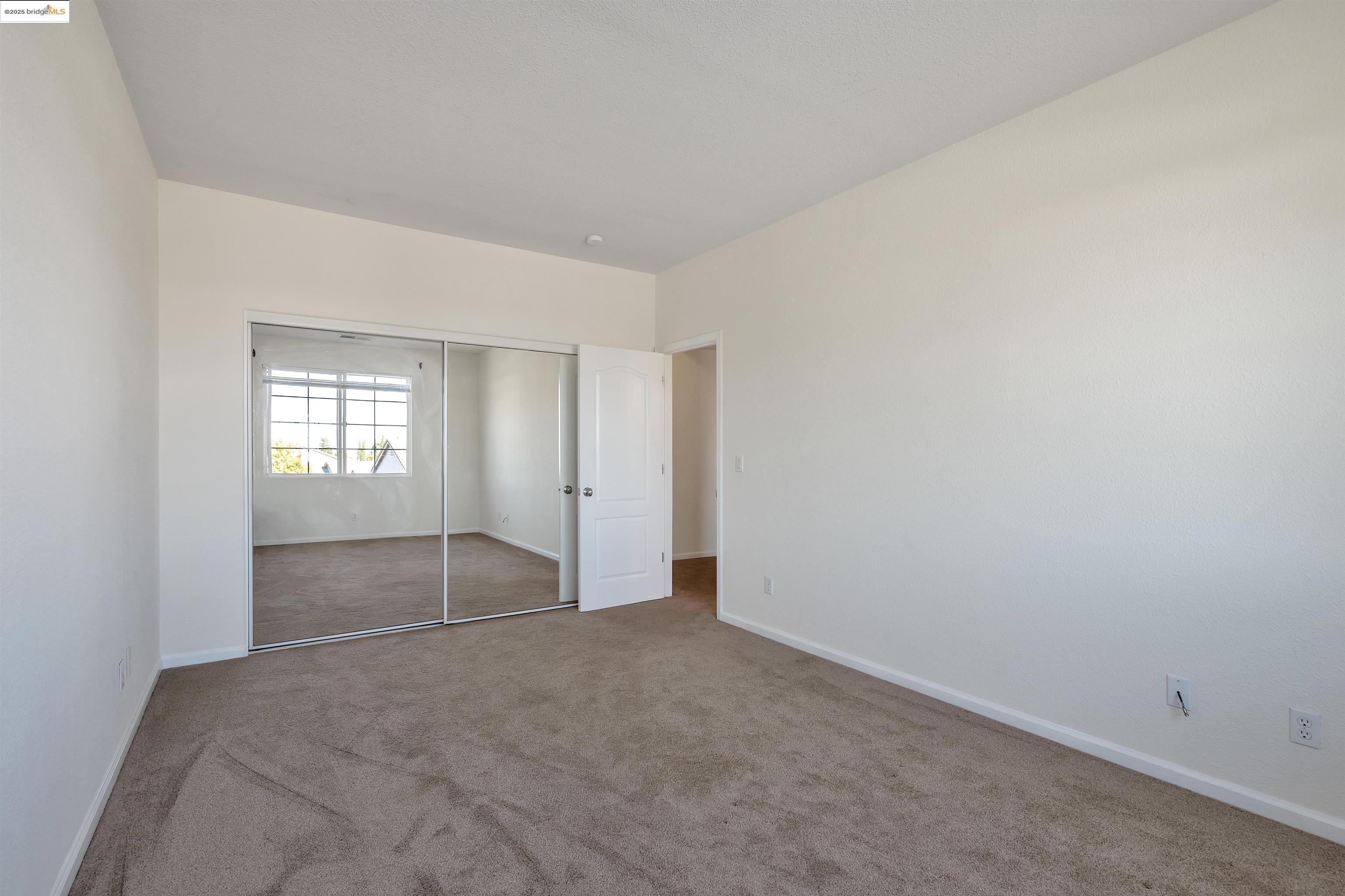 166 Rangewood Drive Pittsburg, CA 94565 - Photo 33 of 42 an empty room with an entryway and closet