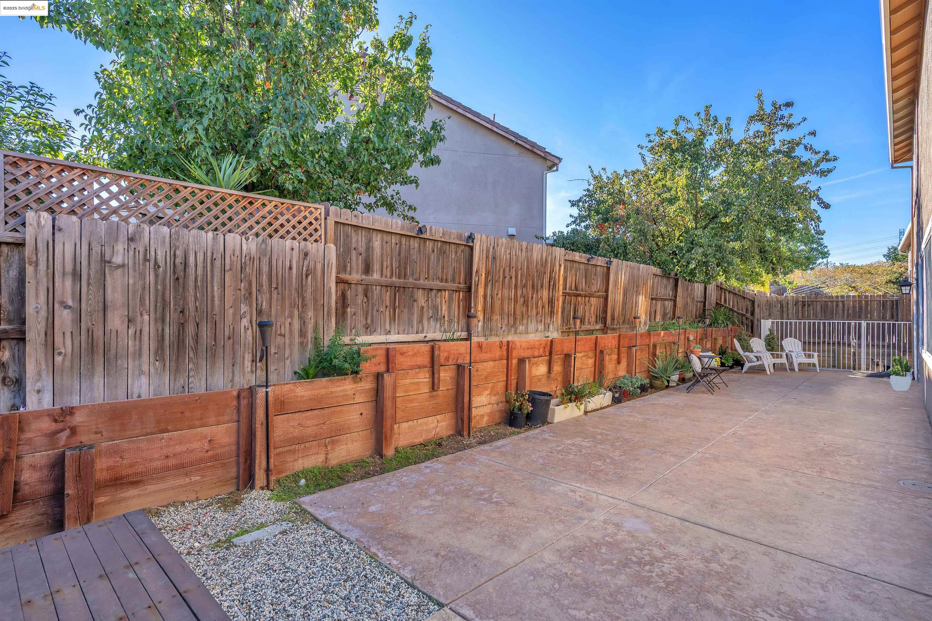 166 Rangewood Drive Pittsburg, CA 94565 - Photo 37 of 42 a view of a backyard with wooden fence
