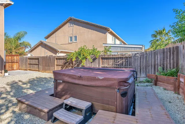 a view of a backyard with a patio