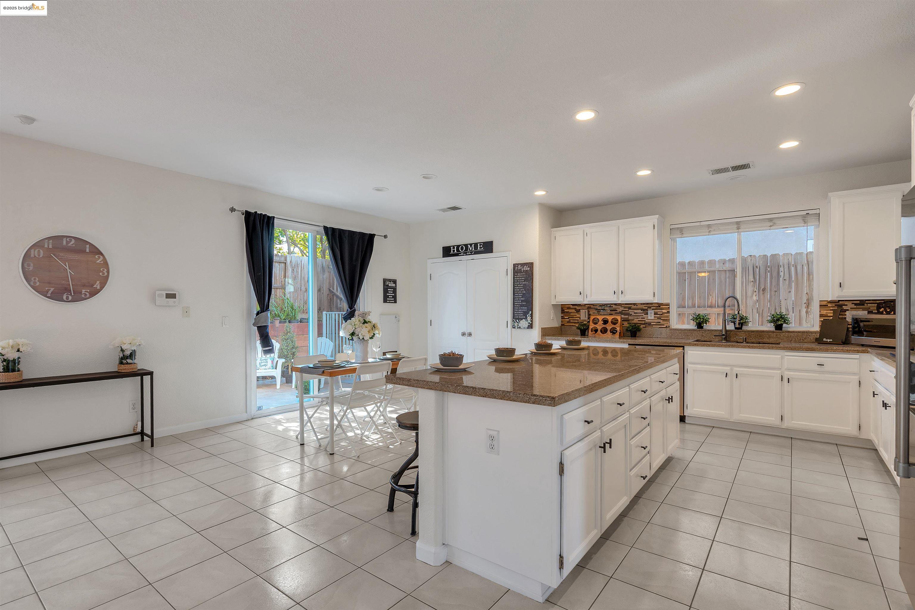 166 Rangewood Drive Pittsburg, CA 94565 - Photo 10 of 42 a kitchen with appliances cabinets and chair