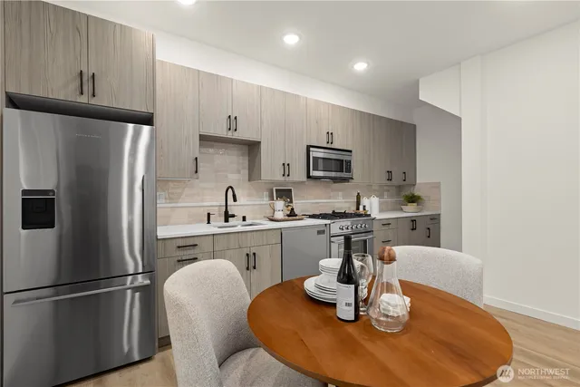 a bedroom with a bed and a painting on the wall