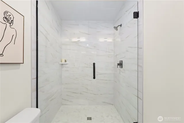 a view of a tree in a city street