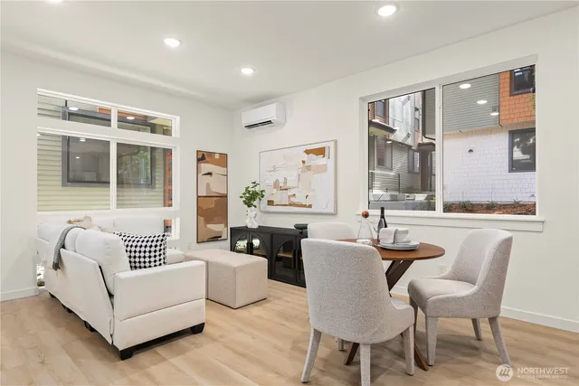 a kitchen with stainless steel appliances a sink and a wooden floor