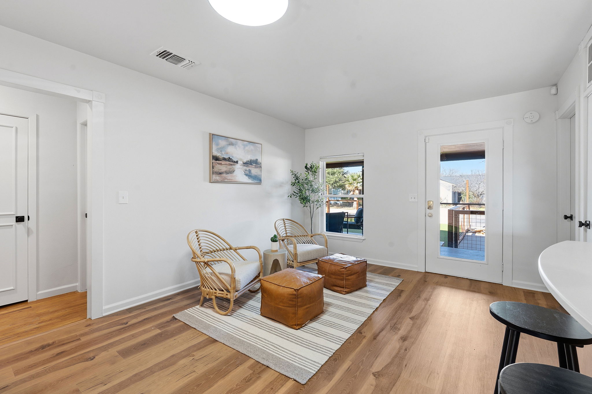 5509 Avenue F Austin, TX 78751 - Photo 13 of 40 Rounded breakfast bar seating along the kitchen peninsula is perfect for quick bites and entertaining.