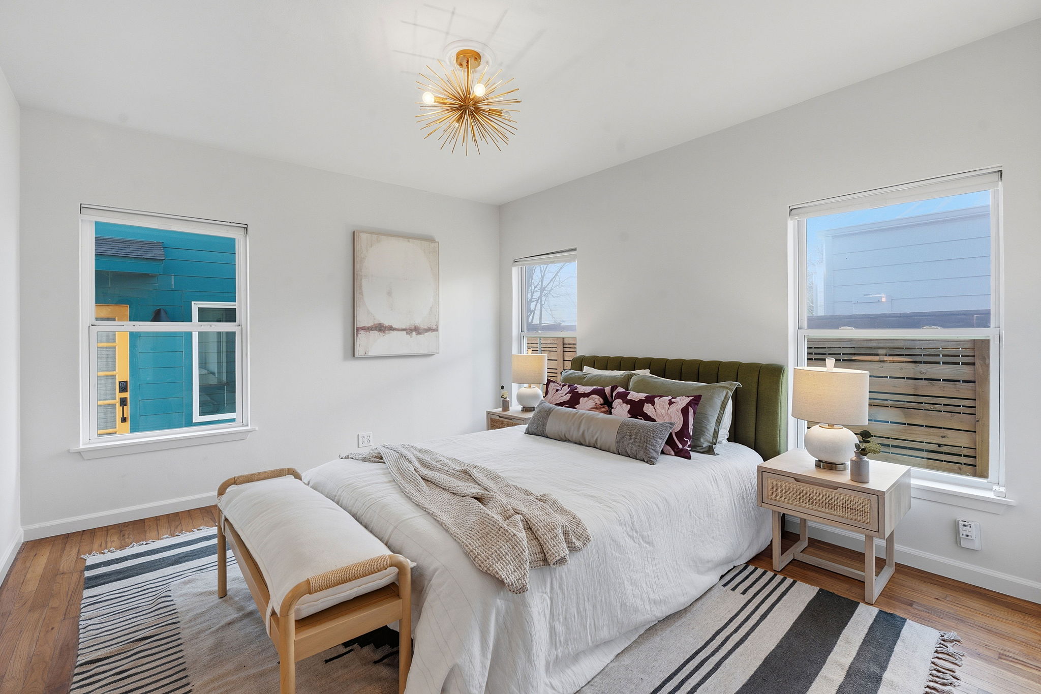 5509 Avenue F Austin, TX 78751 - Photo 18 of 40 The primary suite is a sun-lit retreat with generous windows that bathe the space in warm natural light.