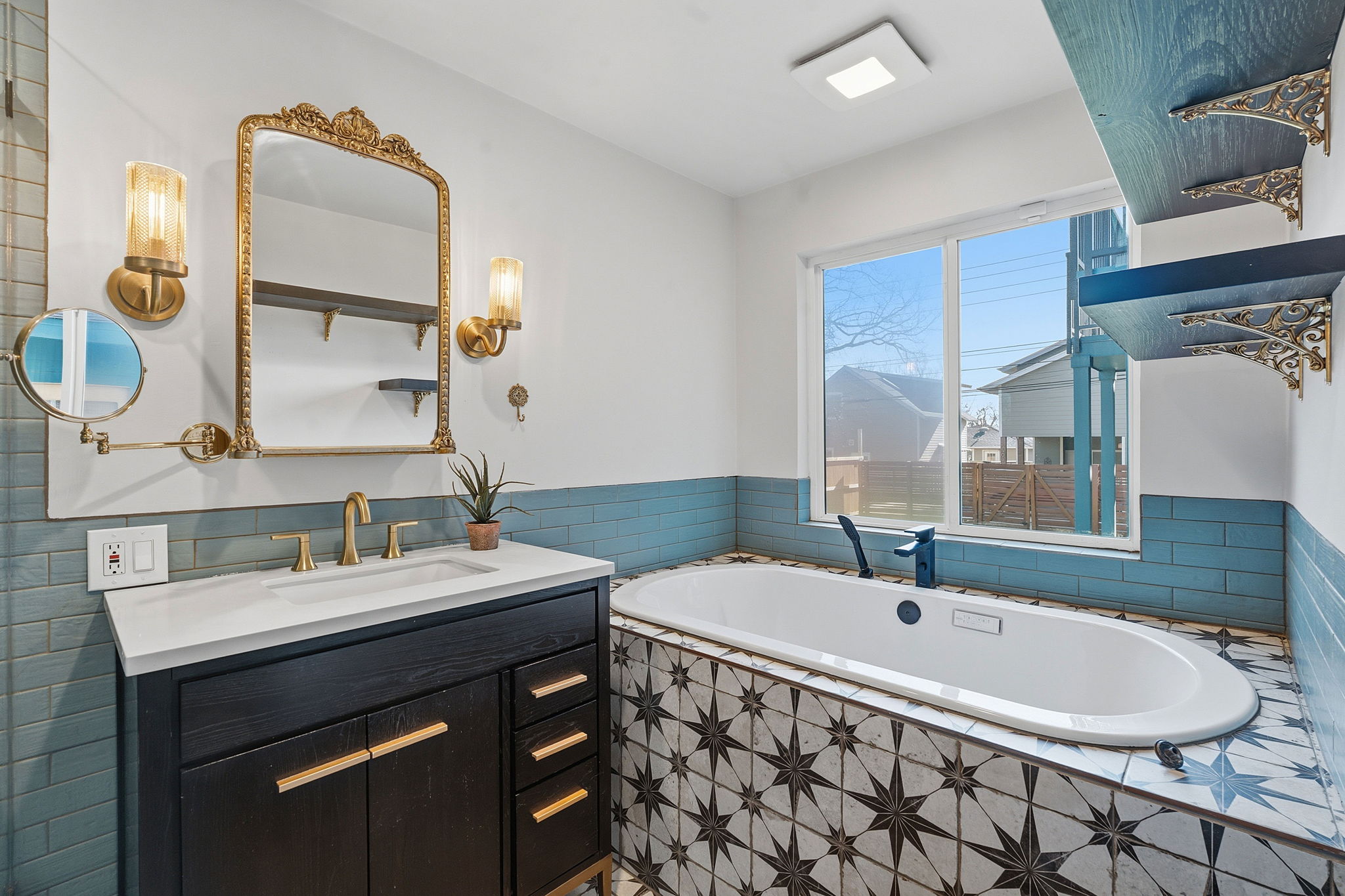 5509 Avenue F Austin, TX 78751 - Photo 20 of 40 The breathtaking primary ensuite is a modern revival at its finest with tastefully selected designer finishes and a soaking tub where you can soak away all your worries.