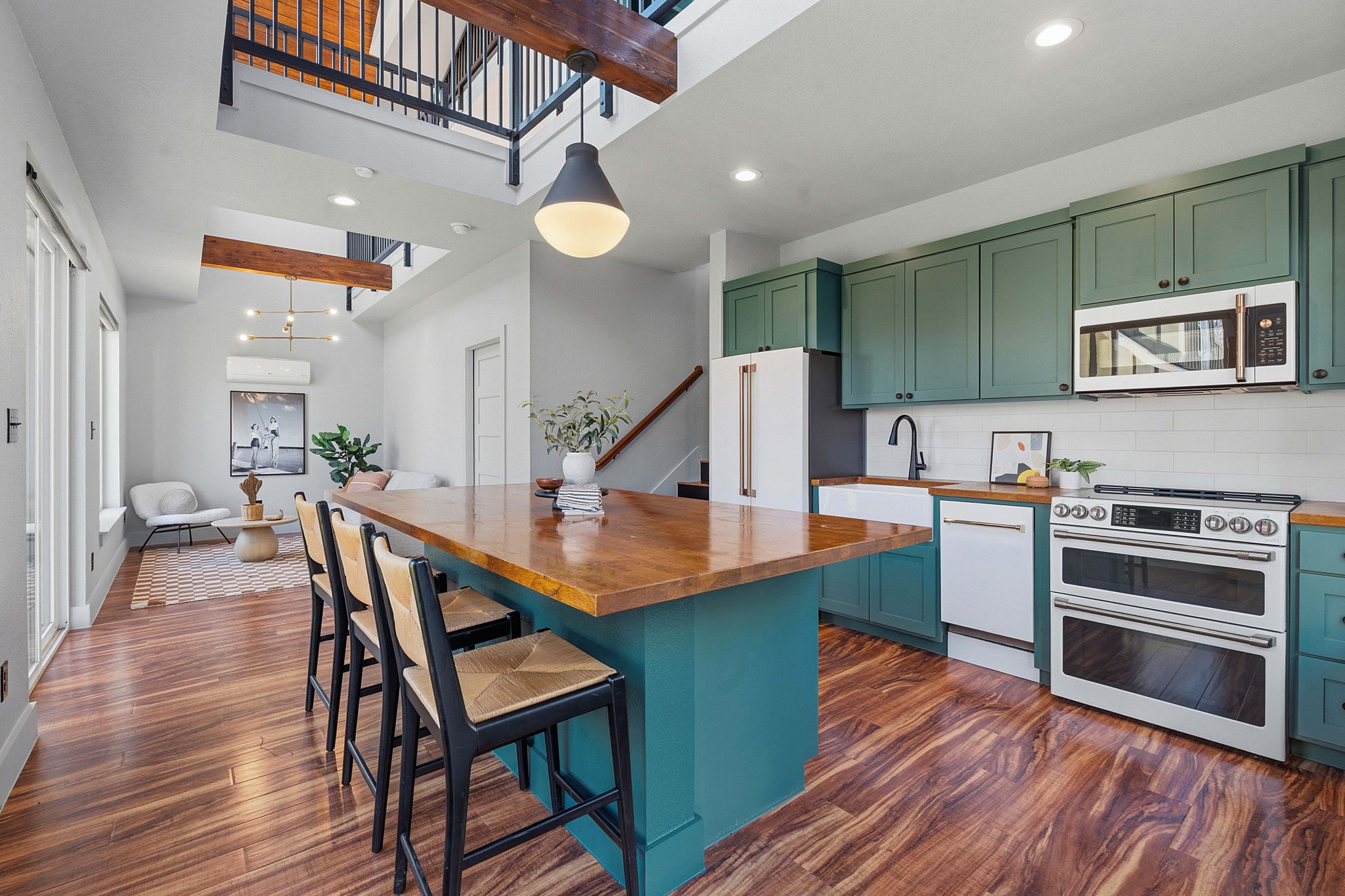 5509 Avenue F Austin, TX 78751 - Photo 6 of 40 The back house comes with a showstopper modern island kitchen open to the living area, plus a bedroom, full bath, and second floor bonus living area plus a third level loft.