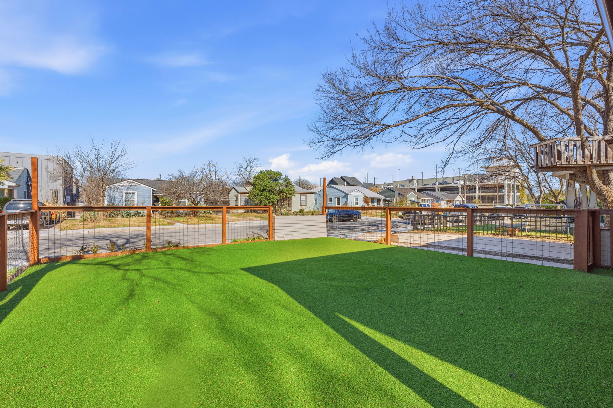 5509 Avenue F Austin, TX 78751 - Photo 8 of 40 Enjoy low maintenance professional landscaping with sustainable turf lawns on both the fenced-in front and backyards.