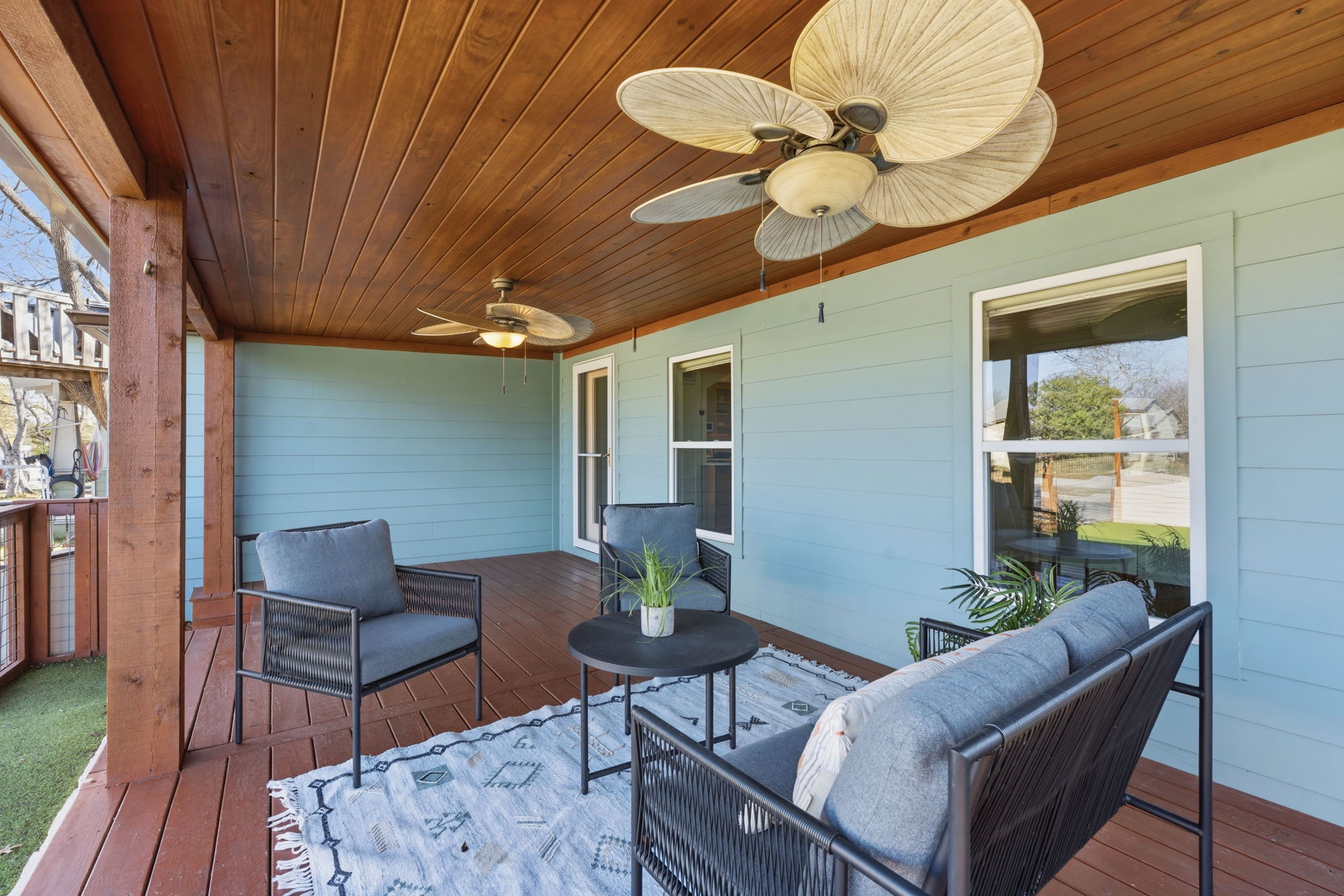 5509 Avenue F Austin, TX 78751 - Photo 10 of 40 Enjoy comfortable outdoor living under the wood wrapped ceiling with an overhead fan to keep the breeze flowing while you relax on the front porch.