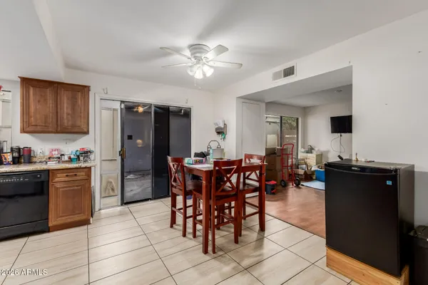 a kitchen with stainless steel appliances granite countertop a refrigerator stove and sink