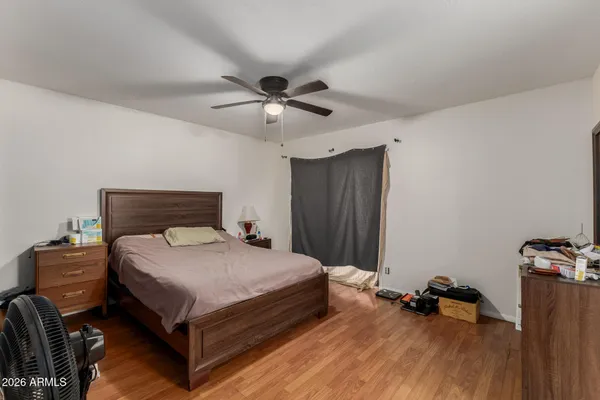 a bedroom with a bed and a dresser