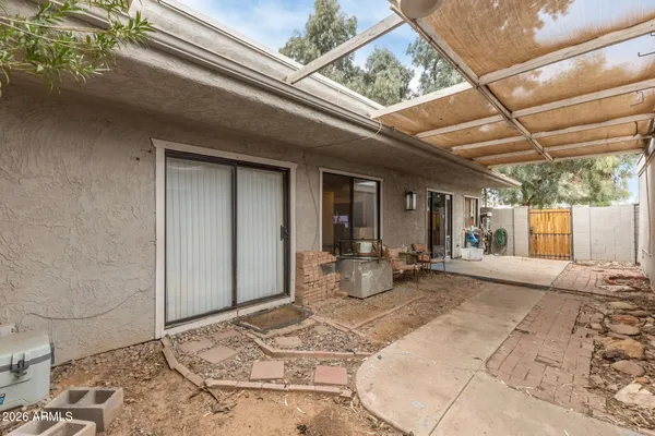 a front view of a house with outdoor seating