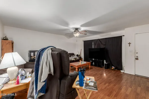 a living room with furniture and a flat screen tv