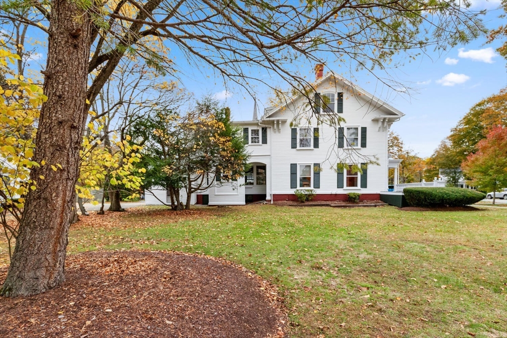 1949 Massachusetts Avenue Lexington, MA 02421 - Photo 4 of 11 a view of a white house with a yard and a large tree