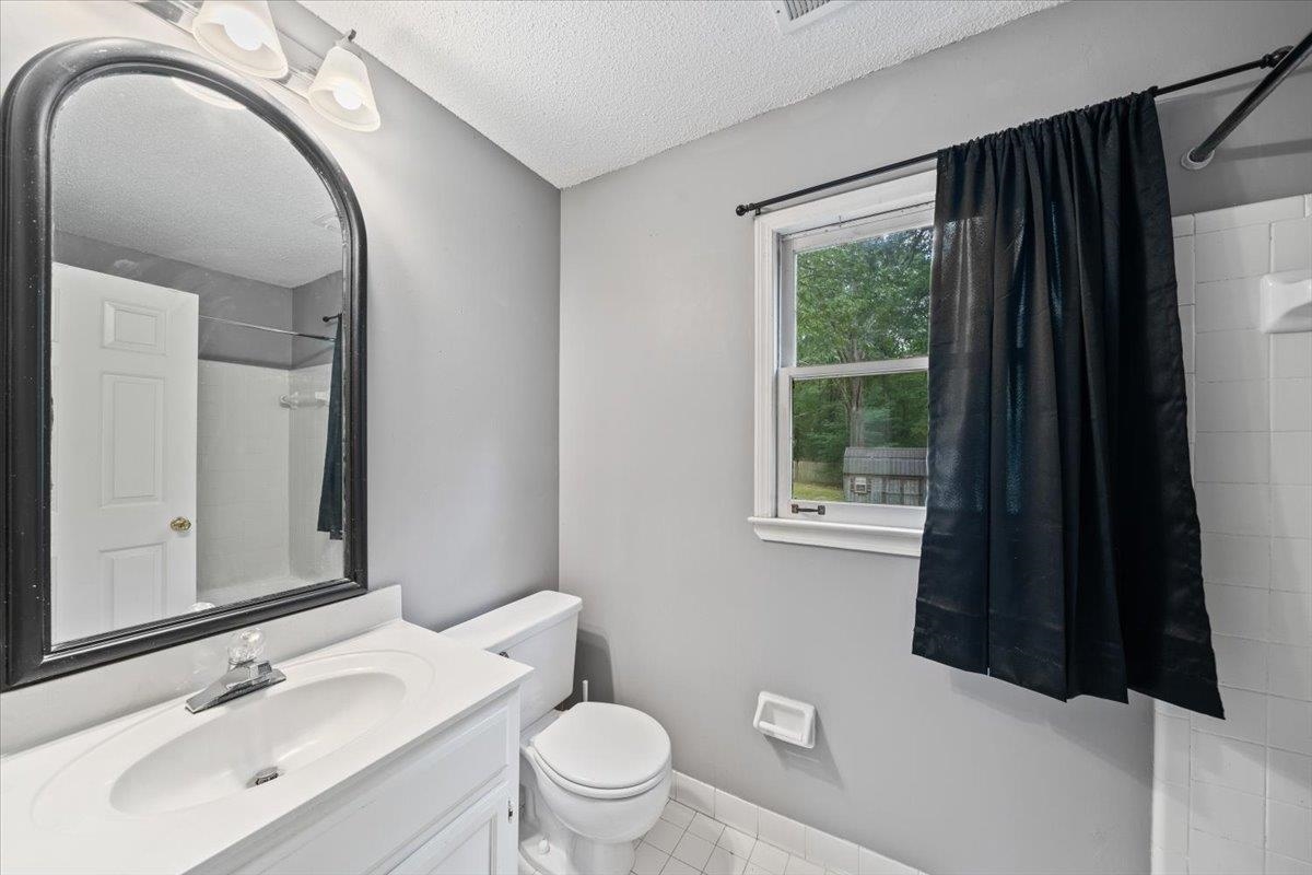 405 Dove Valley Road Collierville, TN 38017 - Photo 17 of 25 a bathroom with a sink and a mirror