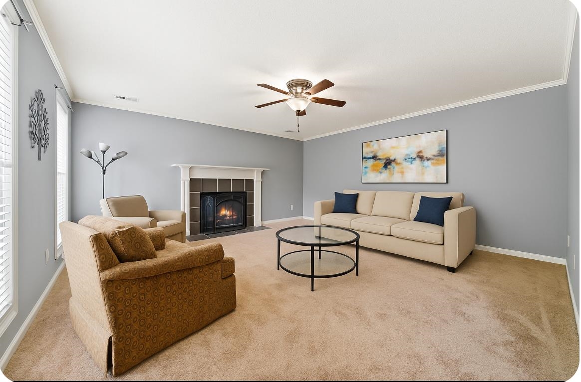 405 Dove Valley Road Collierville, TN 38017 - Photo 21 of 25 a living room with furniture and a fireplace