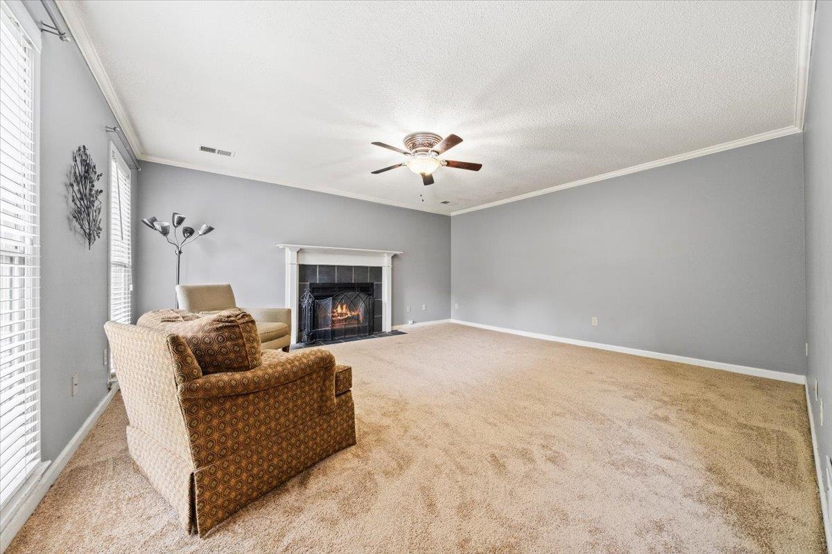 405 Dove Valley Road Collierville, TN 38017 - Photo 3 of 25 a living room with furniture and a fireplace