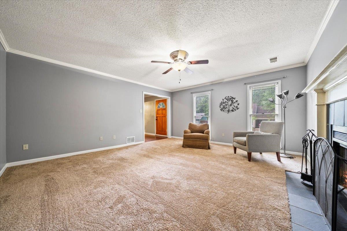 405 Dove Valley Road Collierville, TN 38017 - Photo 4 of 25 a living room with furniture and a chandelier