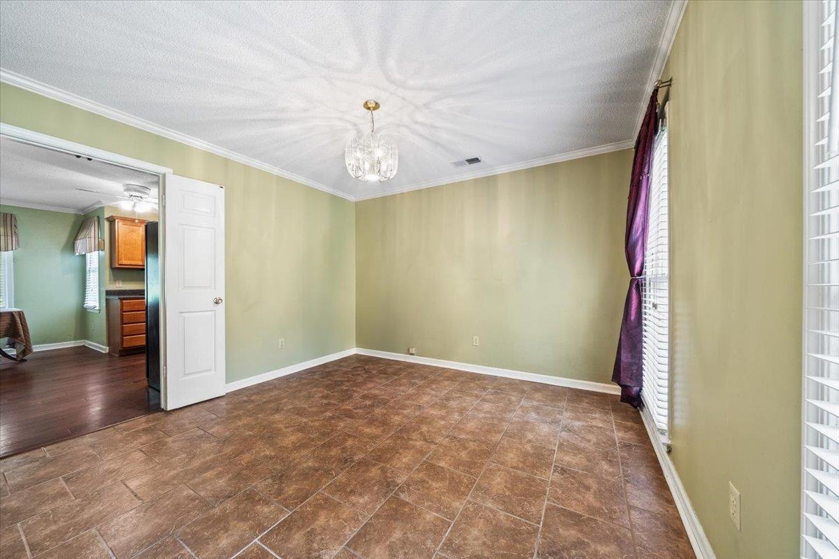 405 Dove Valley Road Collierville, TN 38017 - Photo 5 of 25 a view of an empty room with wooden floor