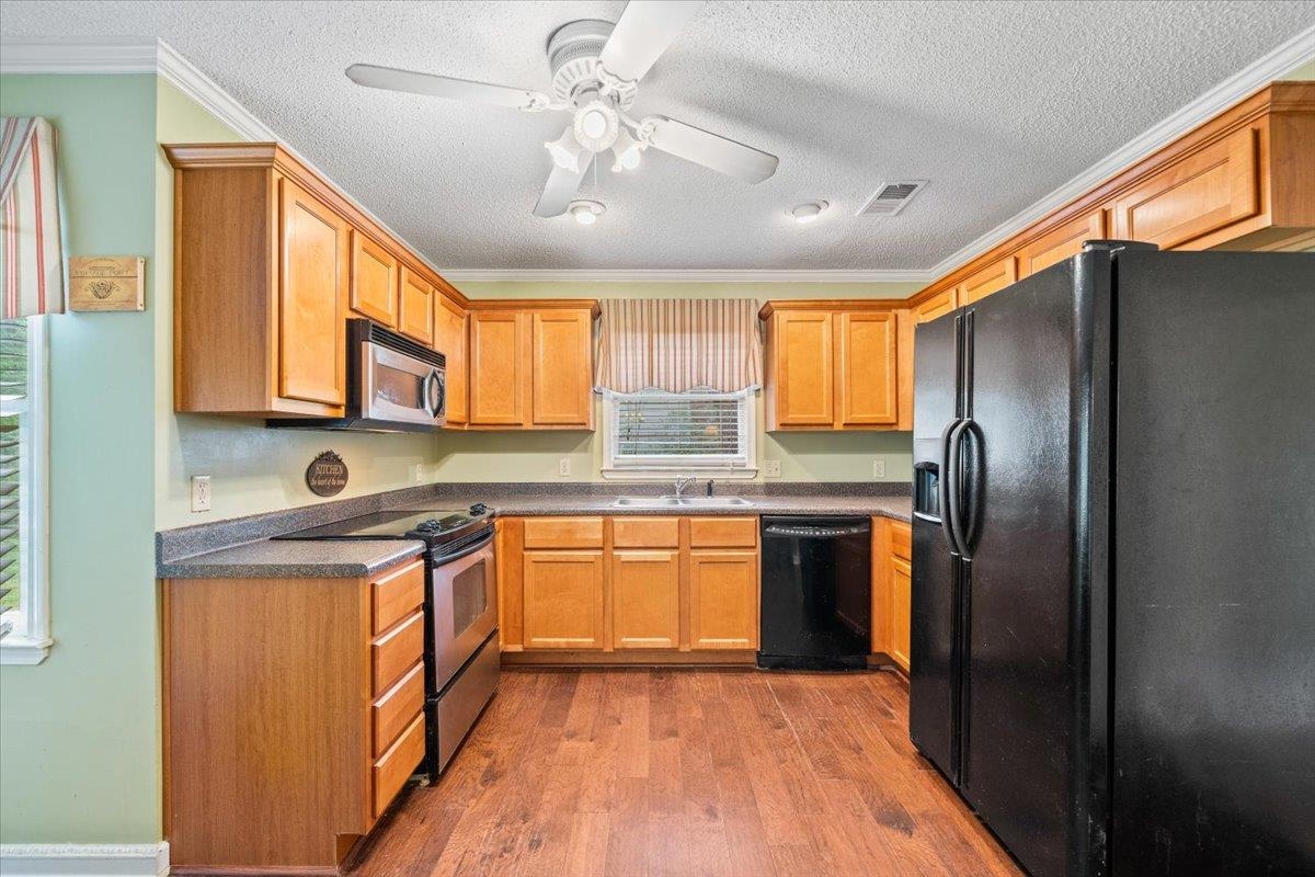 405 Dove Valley Road Collierville, TN 38017 - Photo 10 of 25 a kitchen with stainless steel appliances granite countertop refrigerator a sink a stove a washer dryer and cabinets