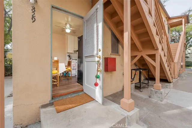 a living room with furniture wooden floor and flat screen tv