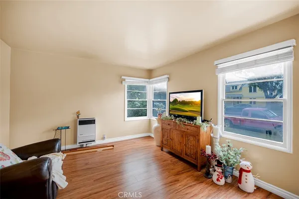a living room with furniture and flat screen tv